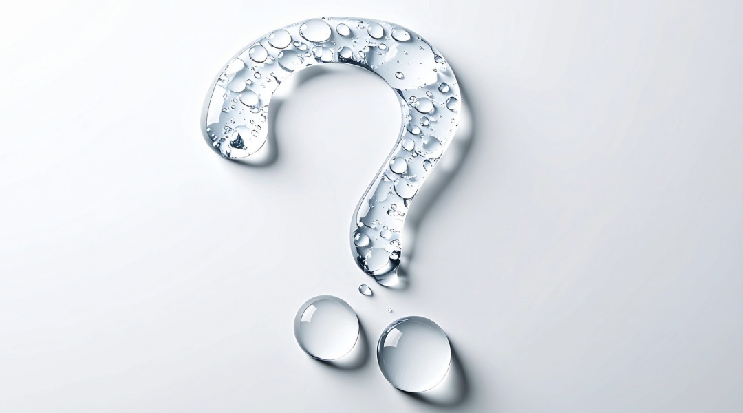 Transparent question mark made of water droplets on a clean white background, symbolizing questions about drinking water quality and safety.