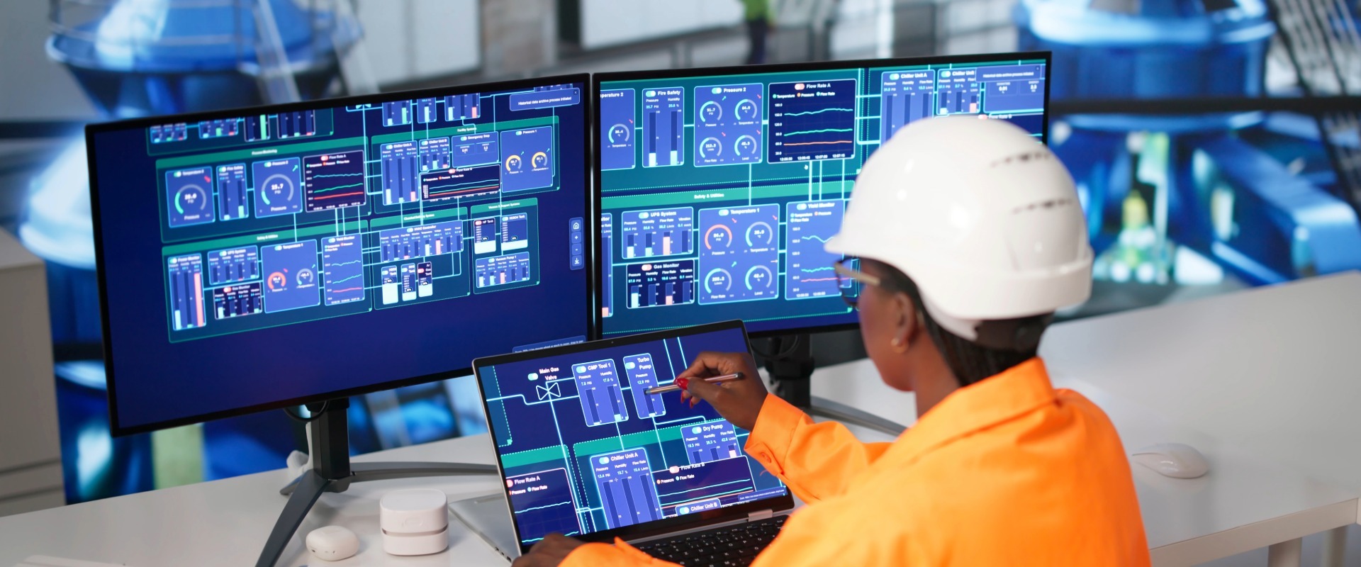 Water utility operator monitoring digital systems used to control water treatment equipment and processes.