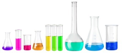 Laboratory glassware containing different colored liquids, representing exposure to mixtures of multiple pharmaceutical compounds.